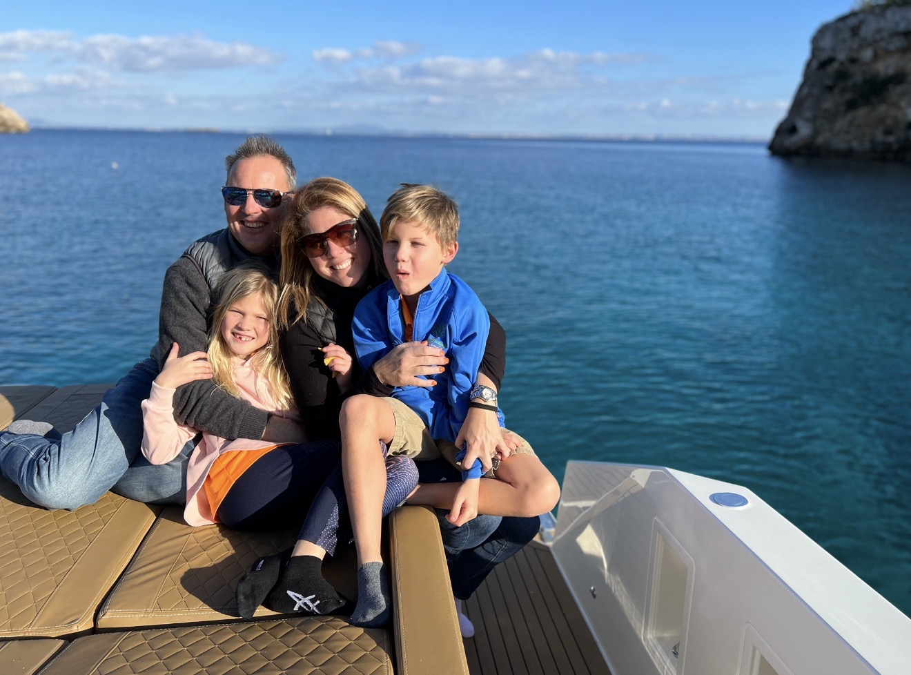 Pamela and Christoph with their two children together on their boat in Mallorca