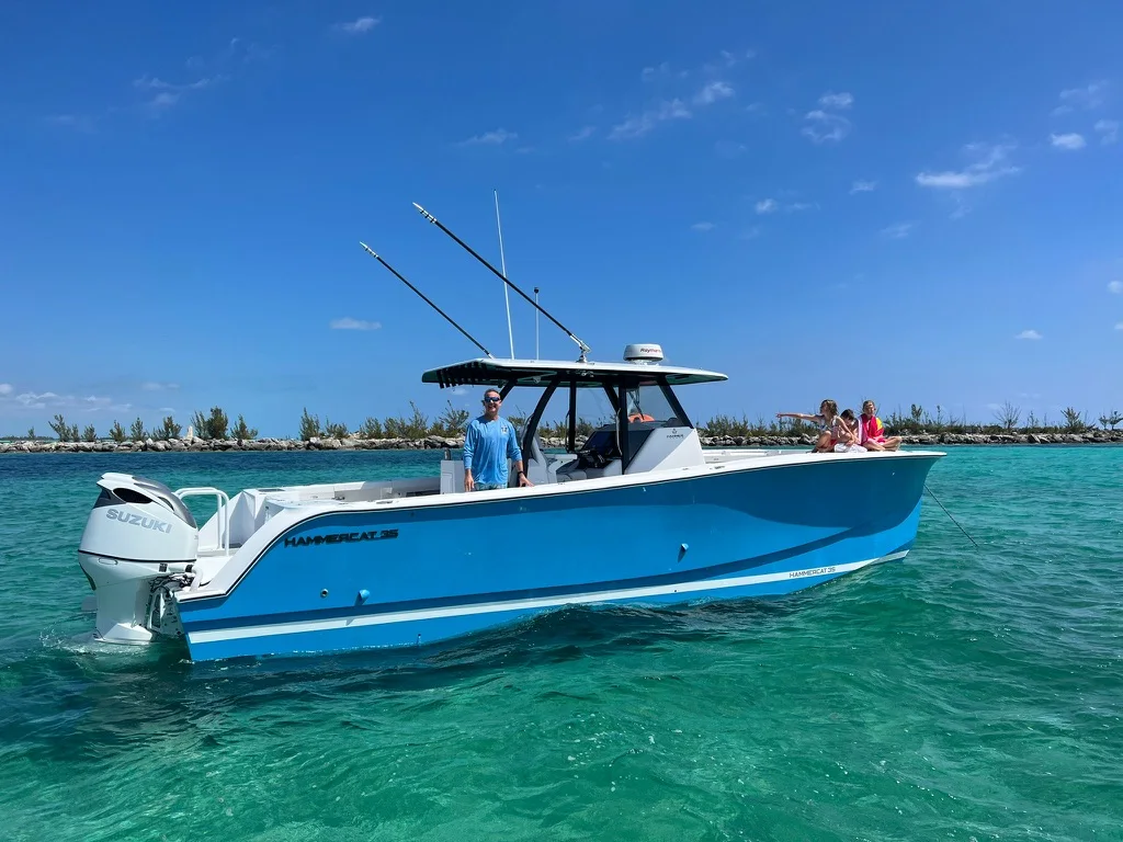 The family HammerCat boat on turquoise water in Grand Bahama